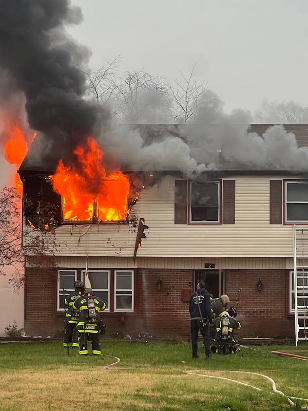 Firefighters making entry to extinguish a fire in Garfield North.