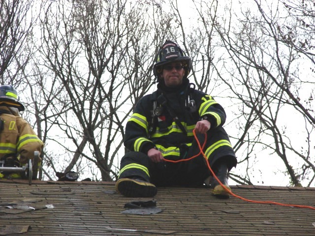 Firefighter Anderson on the roof at the VFW Post fire