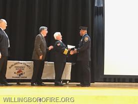 Andre Quarles receiving course completion certification. 