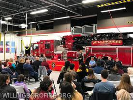 Chief Burnett discusses each honorees biography with the audience.