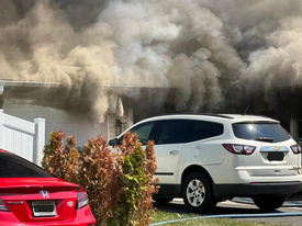 Heavy smoke showing from the front of the home